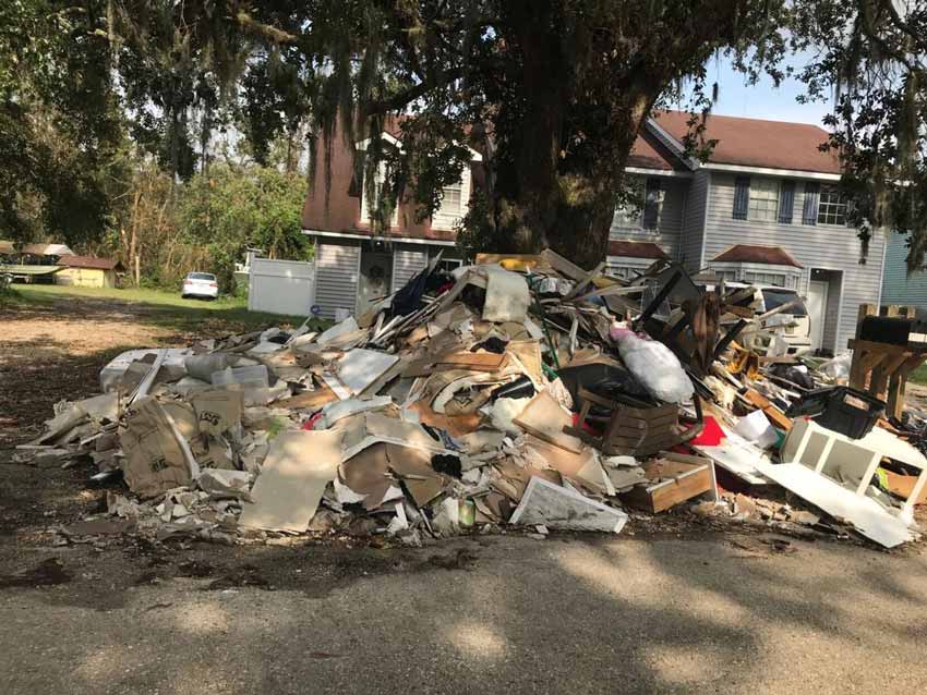 Slidel, LA Debris Pile outside of a damaged home.